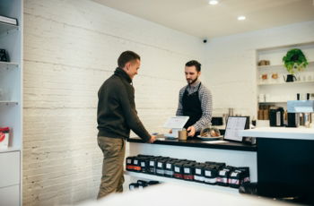 man-buying-item-in-shop.jpg man buying item in shop